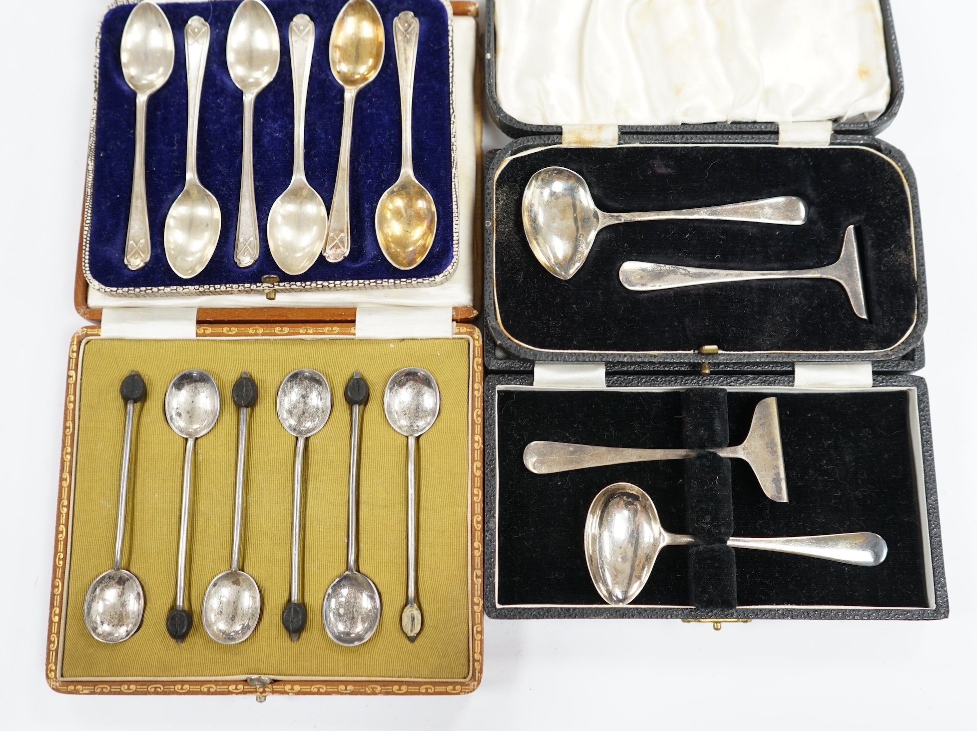 Two cased sets of six silver coffee spoons including bean end and golfing related and two cased silver christening spoons and pushers. Condition - poor to fair